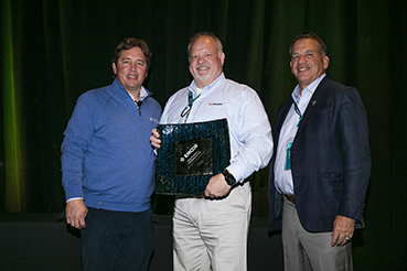Company leadership with the award  